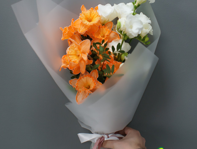 Bouquet with orange daffodils and white freesia photo